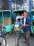 Mom and Dad in a tricycle